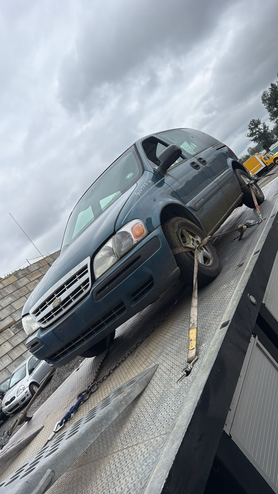 Tow truck collecting an unwanted car on Bowen Island